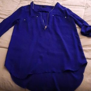 Blue sheer blouse can fold up sleeves and button has a zipper in middle small